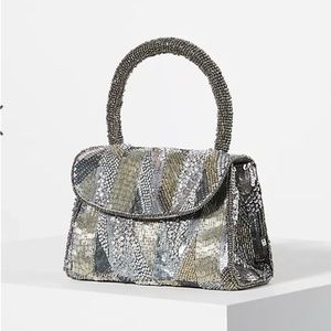 Anthropologie silver sequence purse. NWT “the Samara bag” even has beads.